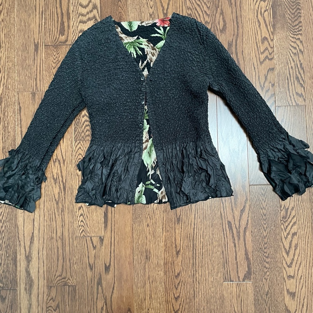 Beautiful, unique reversible blazer. Stretch bubble material. Ruffled borders.